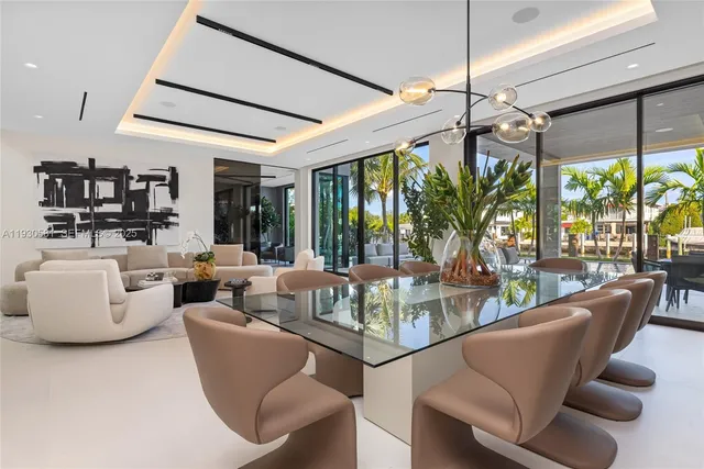 a view of swimming pool with a table and chairs in front of it