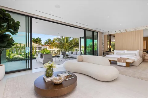 a view of a balcony with potted plants and palm trees