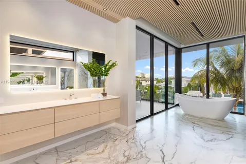 a bathroom with a toilet a sink and shower