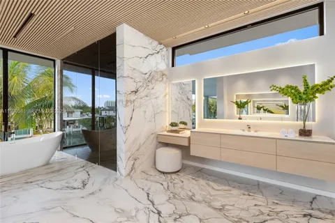 a bathroom with a toilet sink and shower