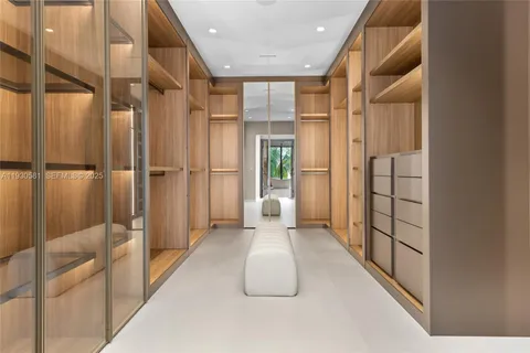 a living room with furniture a flat screen tv and a large window