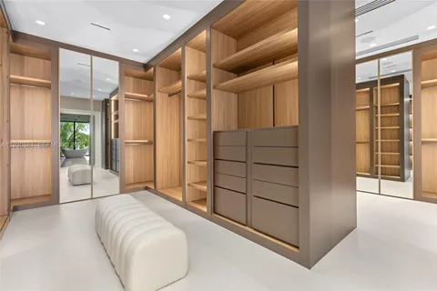 a view of outdoor kitchen with furniture and a potted plant