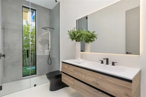 a view of a house with swimming pool and sitting area