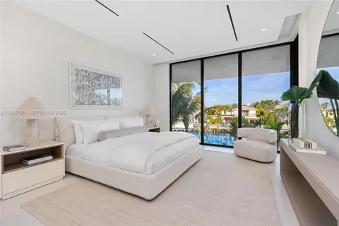 a view of a lake with a large building in the background