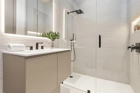 an aerial view of a house with a garden and lake view