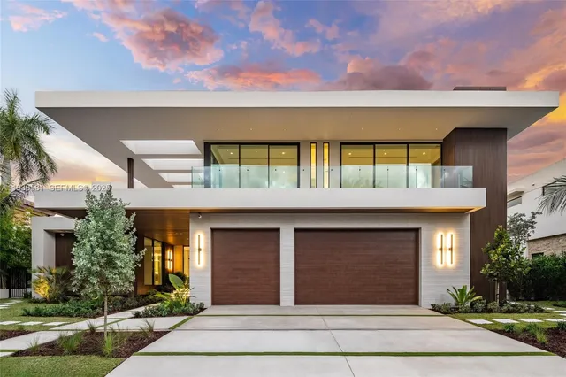 a kitchen with a sink and chairs