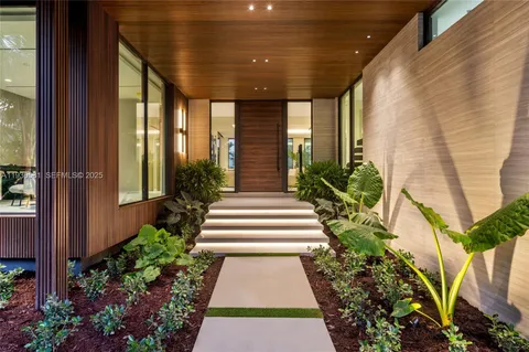 a kitchen with granite countertop a sink and a large window