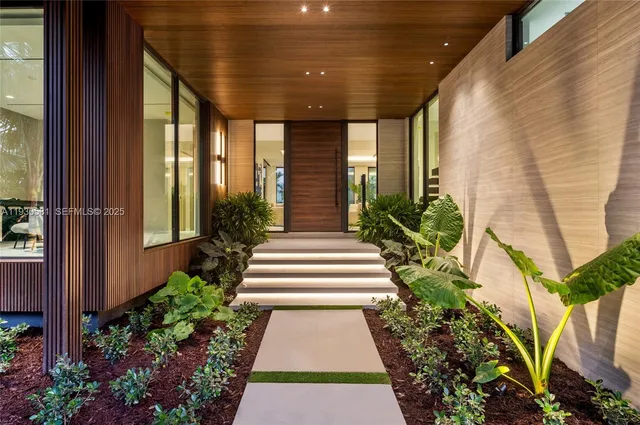 a kitchen with granite countertop a sink and a large window