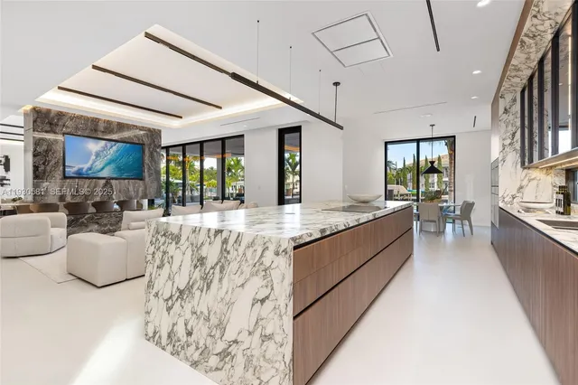 a dining room with furniture and a large window