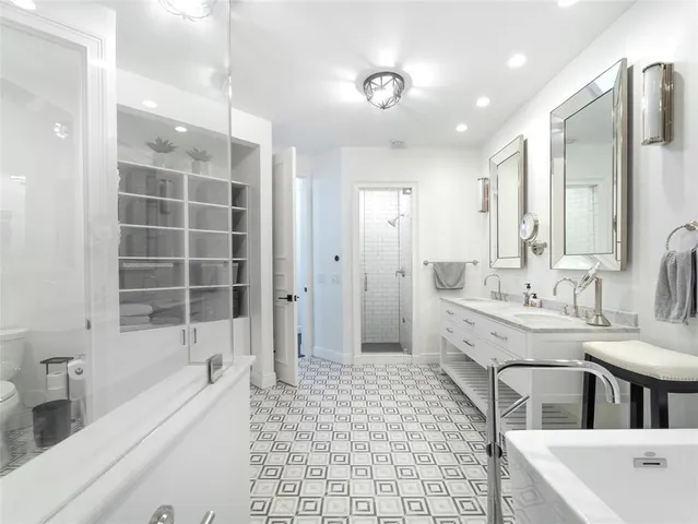 a living room with furniture and a book shelf