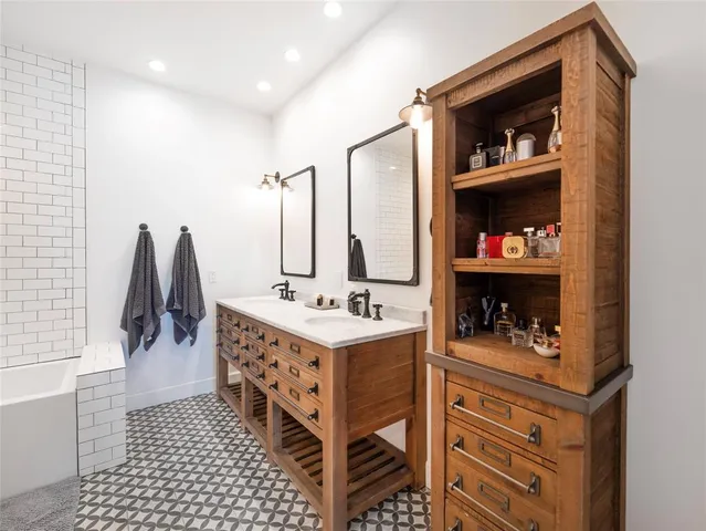 a bathroom with a toilet a sink and bathtub