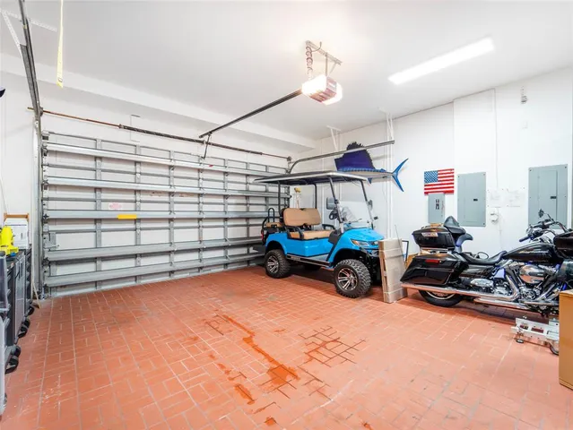 a balcony with furniture and a potted plant