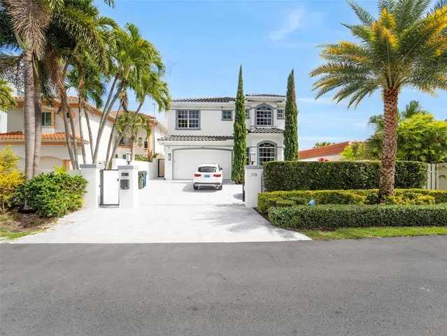 a view of a house with entrance gate