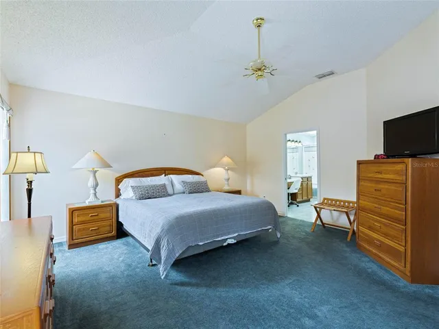 a bedroom with bed and window