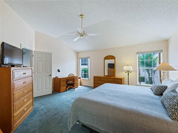 a bedroom with a bed and furniture