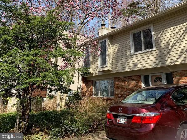 a car parked in front of a house
