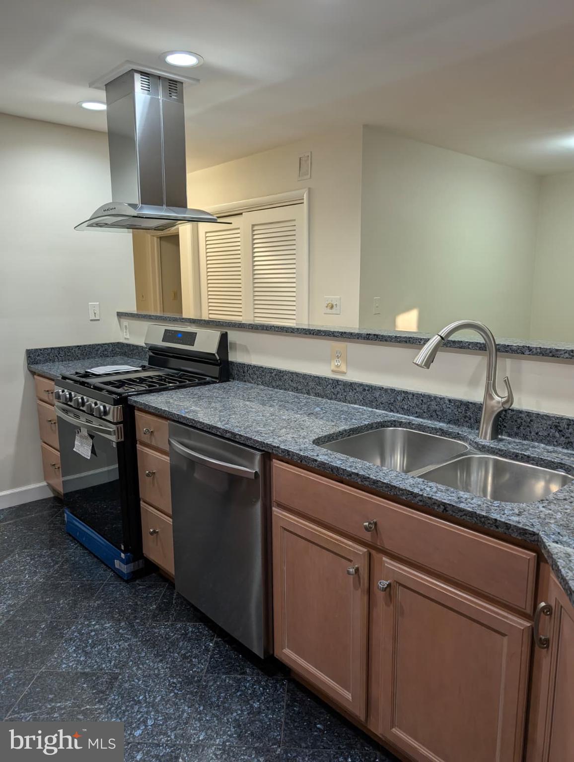 6705 Goldsboro Road Bethesda, MD 20817 - Photo 25 of 60 a kitchen that has a sink and a stove