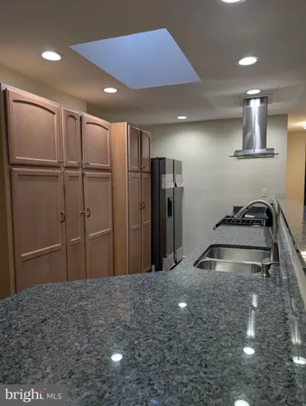 a bathroom with a glass door shower