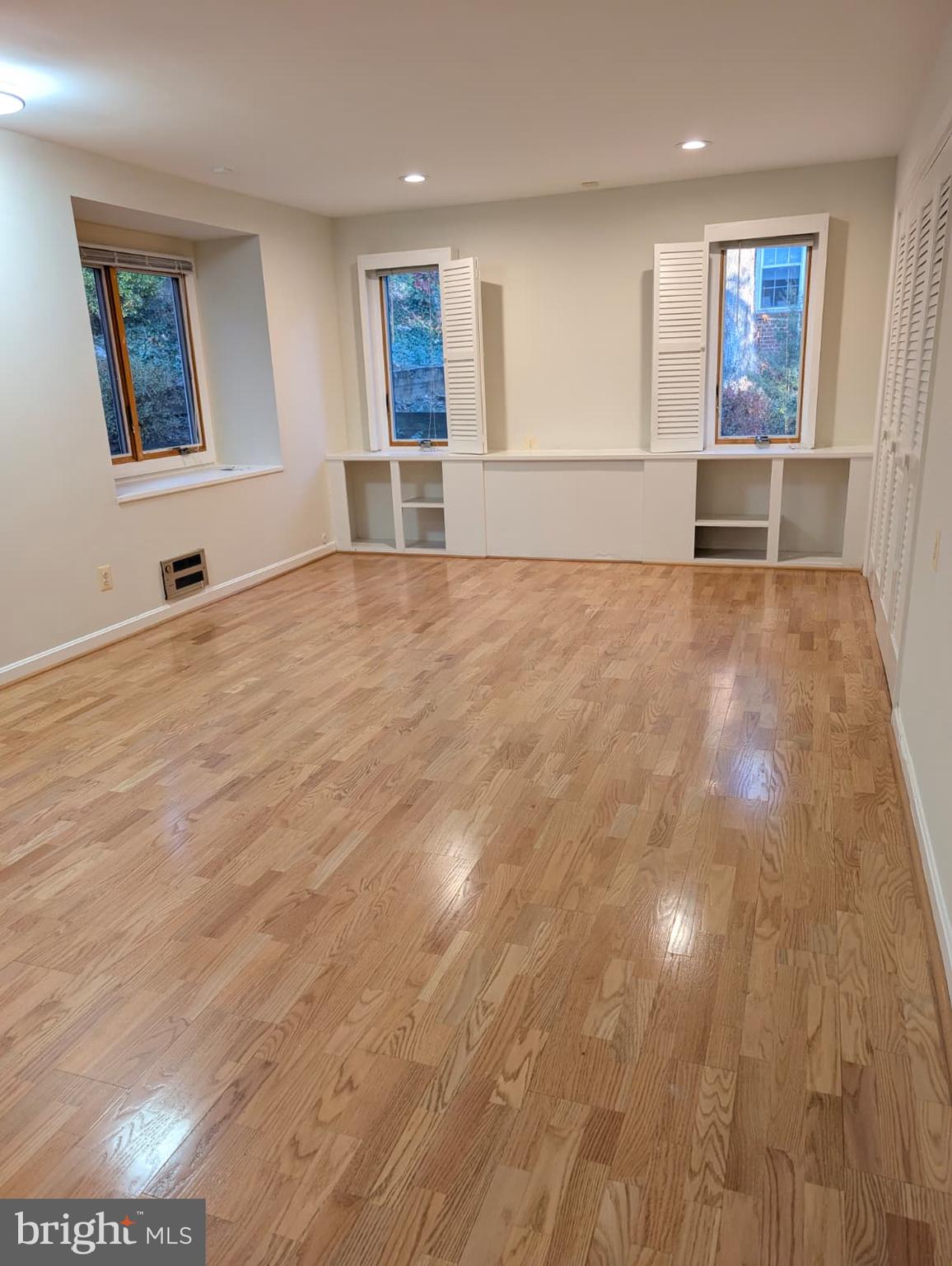6705 Goldsboro Road Bethesda, MD 20817 - Photo 28 of 60 a view of empty room with wooden floor and fan