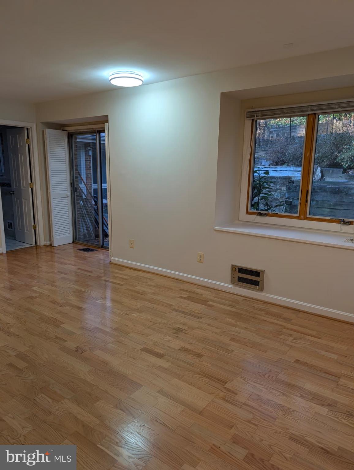 6705 Goldsboro Road Bethesda, MD 20817 - Photo 30 of 60 a view of a room with wooden floor and window