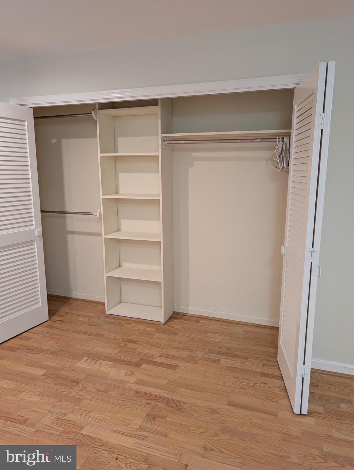 6705 Goldsboro Road Bethesda, MD 20817 - Photo 31 of 60 a view of an empty room with wooden floor and closet