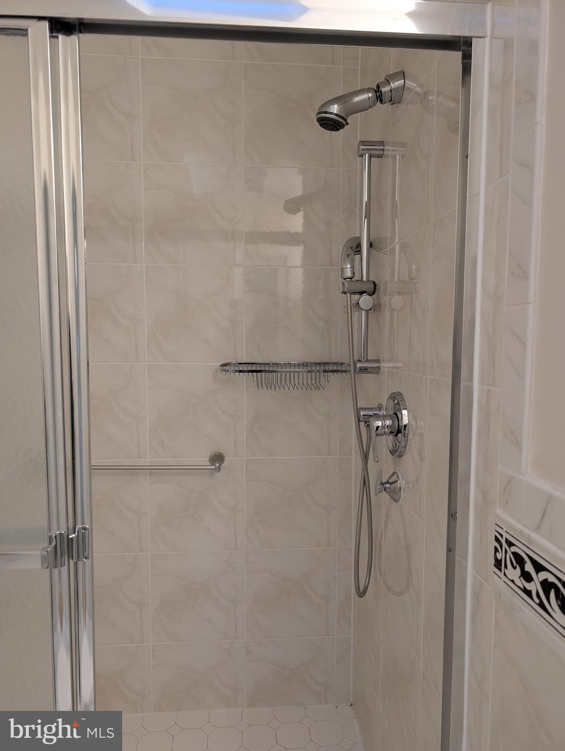 6705 Goldsboro Road Bethesda, MD 20817 - Photo 36 of 60 a bathroom with a shower