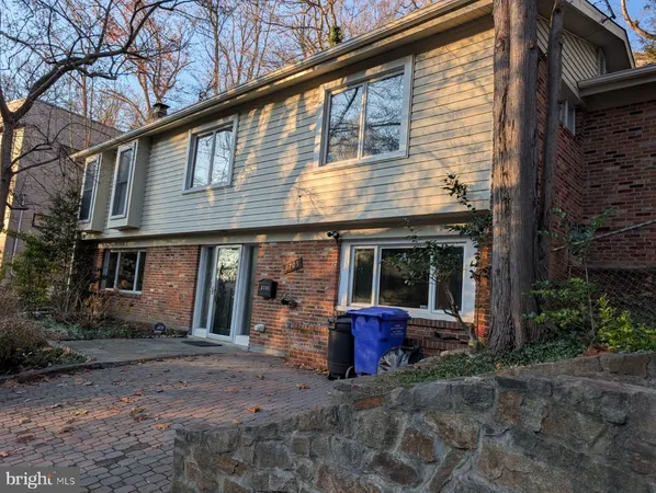 a view of a house with a porch and furniture