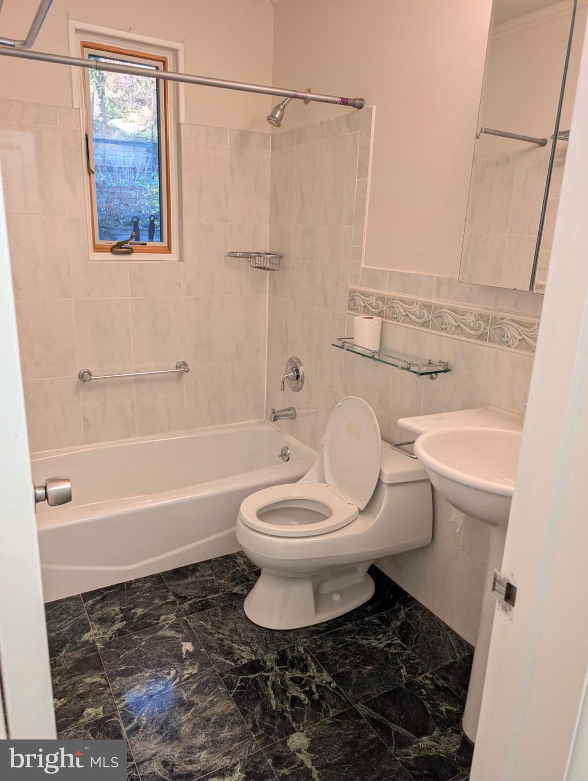 6705 Goldsboro Road Bethesda, MD 20817 - Photo 41 of 60 a bathroom with a toilet and a shower