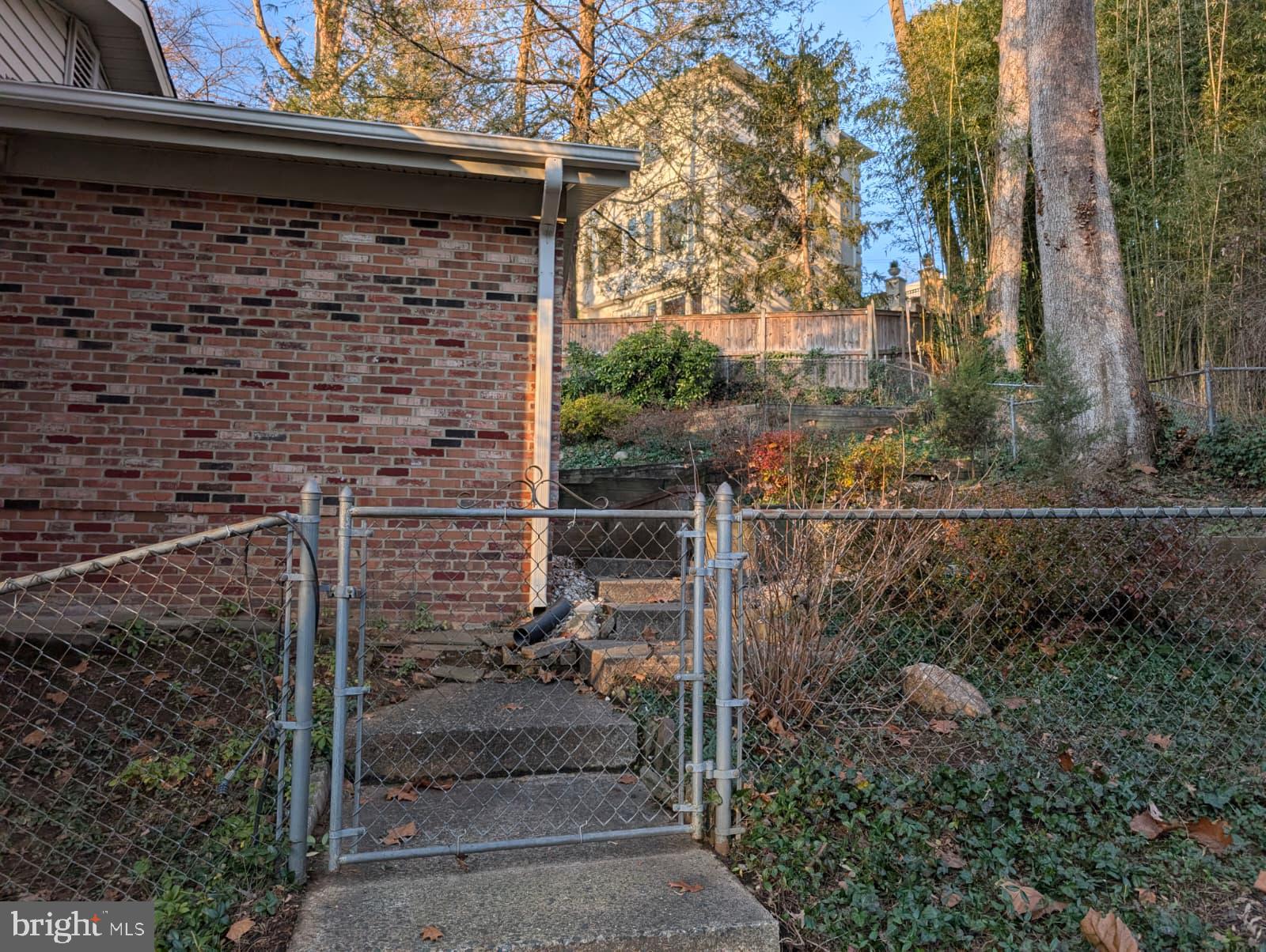 6705 Goldsboro Road Bethesda, MD 20817 - Photo 43 of 60 a view of a door and a wooden bench