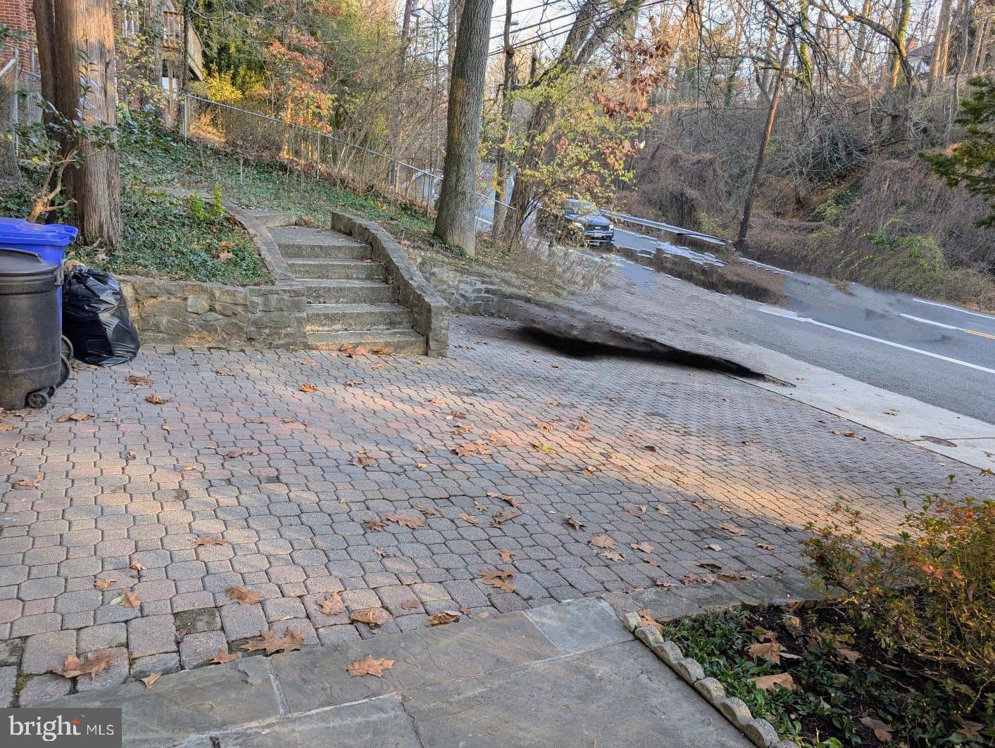 6705 Goldsboro Road Bethesda, MD 20817 - Photo 5 of 60 a view of a backyard with large trees