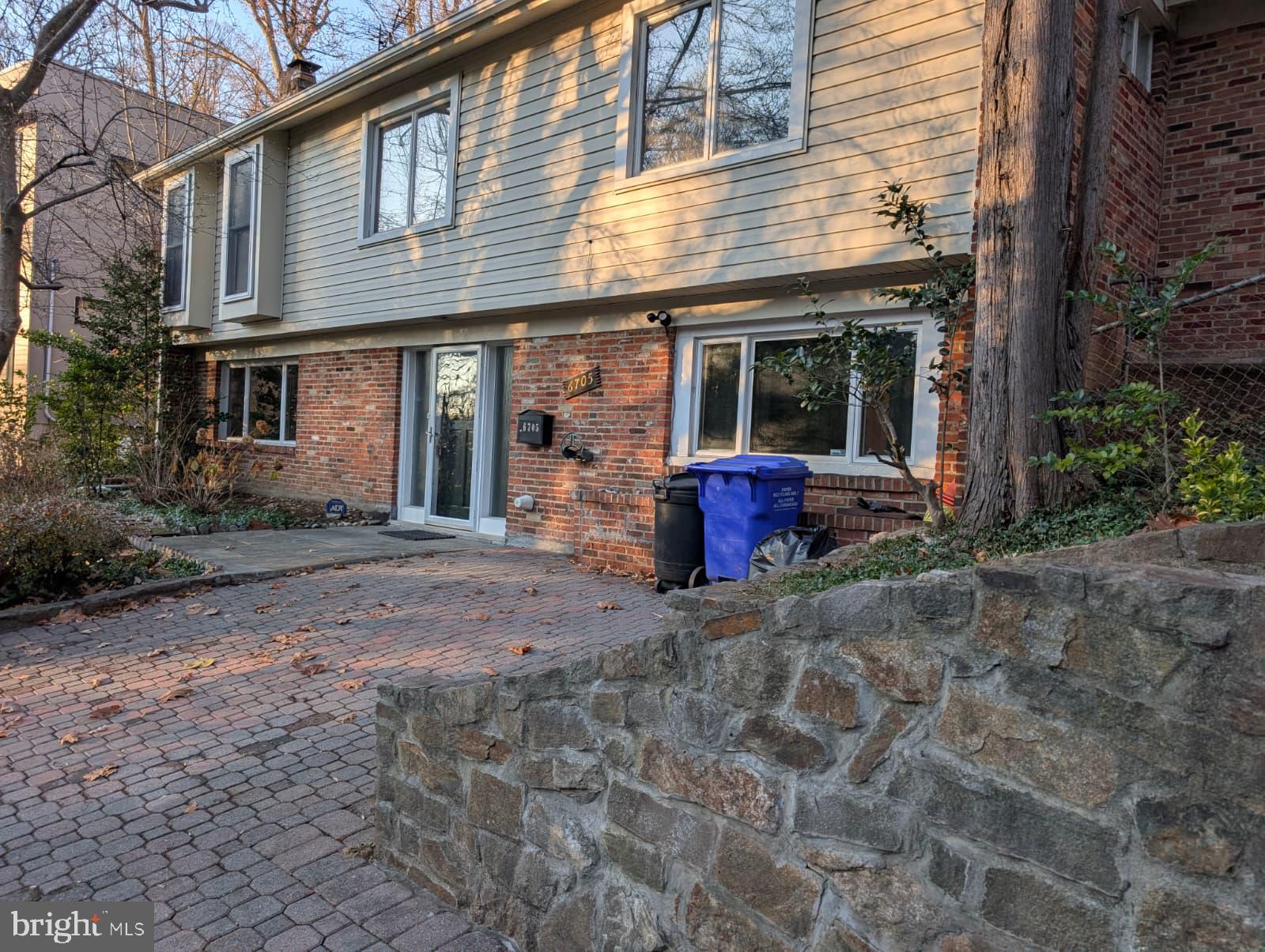 6705 Goldsboro Road Bethesda, MD 20817 - Photo 6 of 60 a front view of a house with basket ball court and outdoor seating