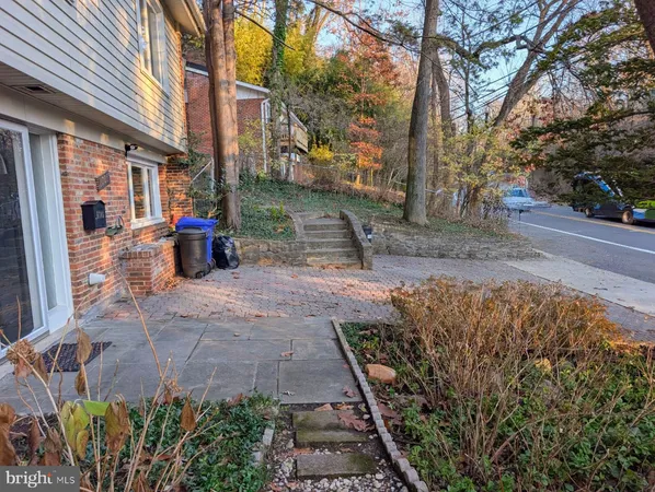 a view of a backyard with sitting area