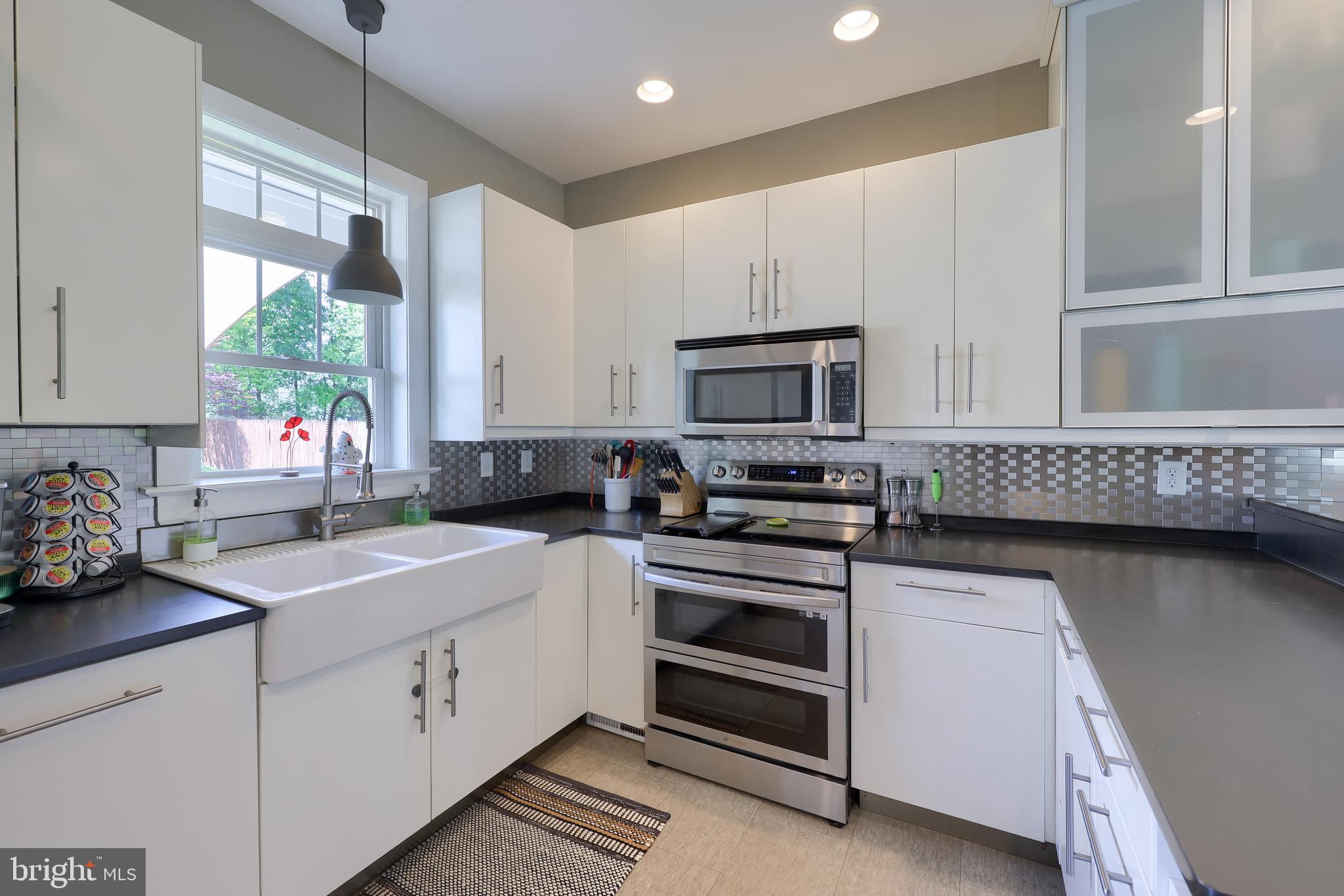 356 North Broad Street Lititz, PA 17543 - Photo 13 of 53 a kitchen with granite countertop a sink stainless steel appliances and cabinets