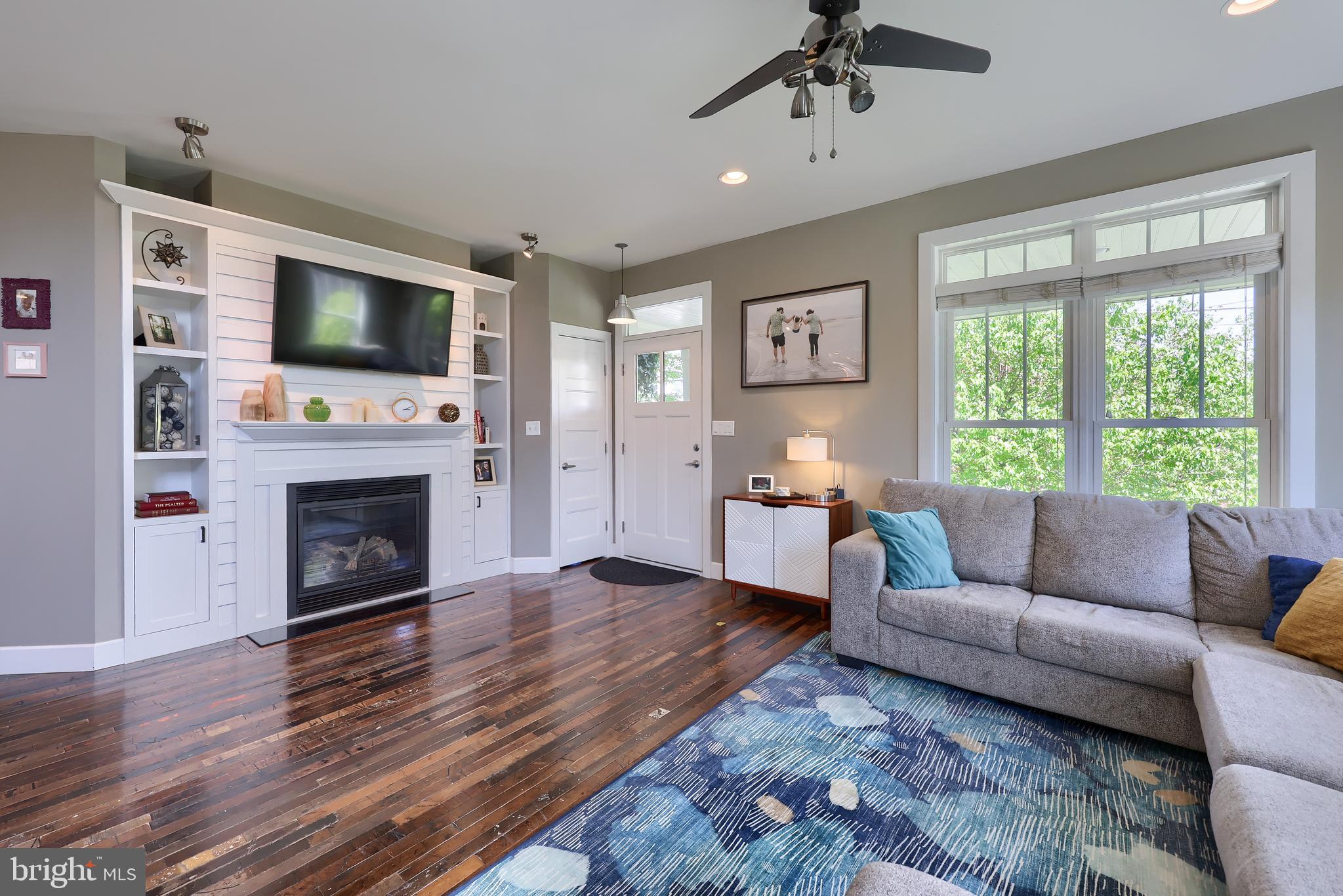 356 North Broad Street Lititz, PA 17543 - Photo 8 of 53 a living room with furniture a flat screen tv and a fireplace