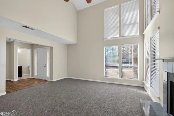 a view of an empty room with a fireplace