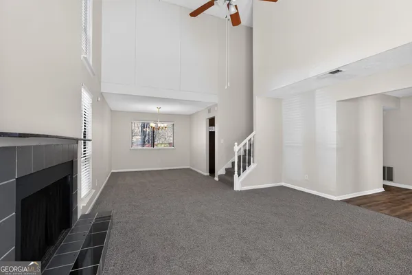 a view of empty room with fireplace