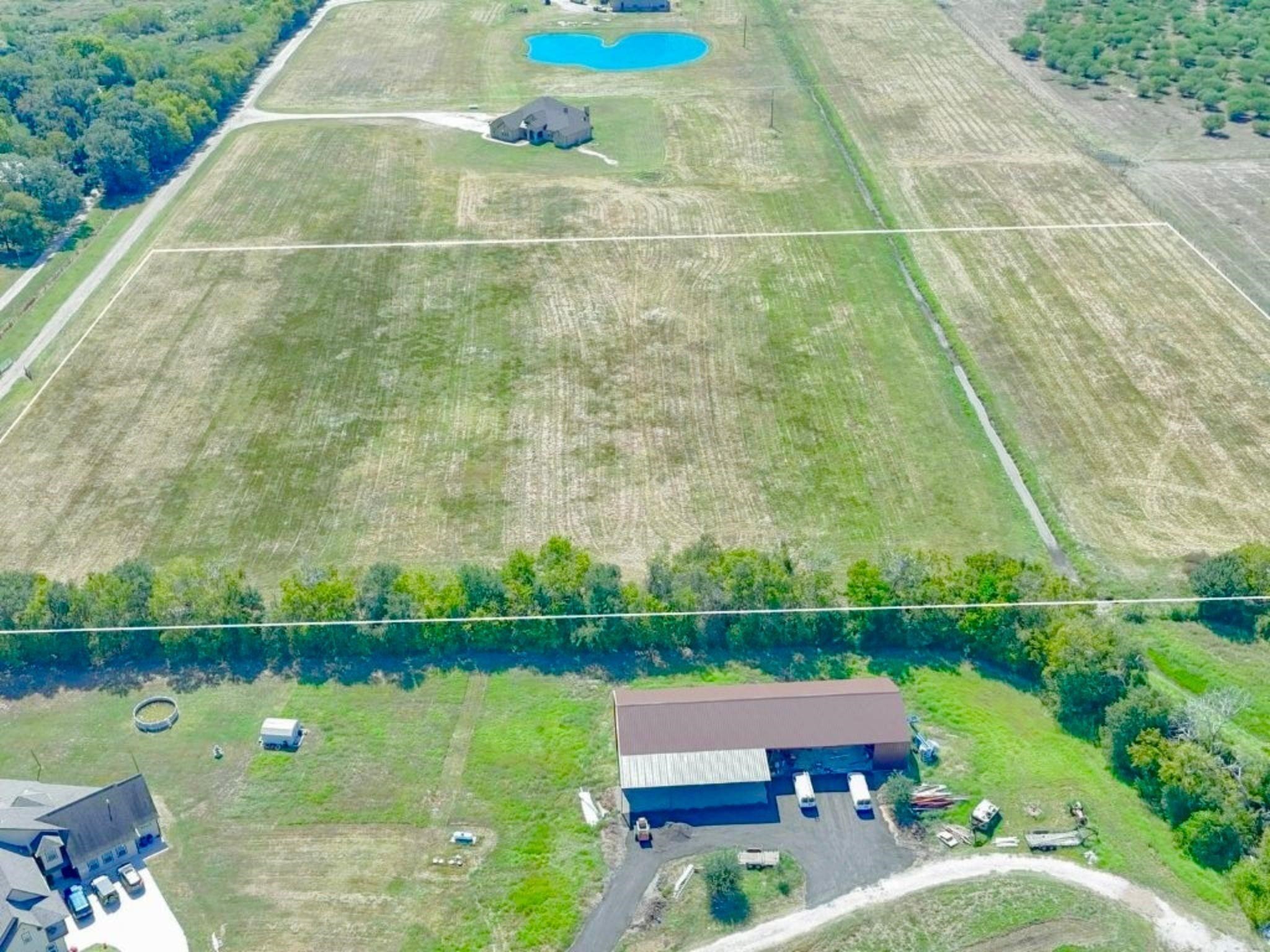0 Philip Evan Road Needville, TX 77461 - Photo 4 of 14 a aerial view of a house with a lake view