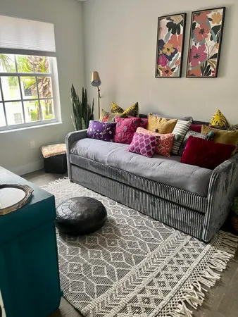 a bedroom with furniture and a window