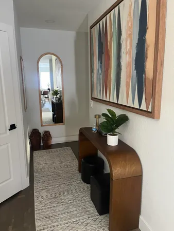 a view of a living room and a balcony
