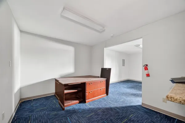 a bedroom with a bed and a table in it