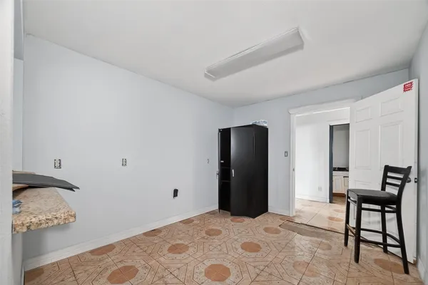 a bedroom with a bed and a table in it