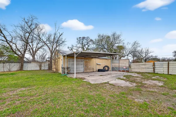 a view of backyard with green space