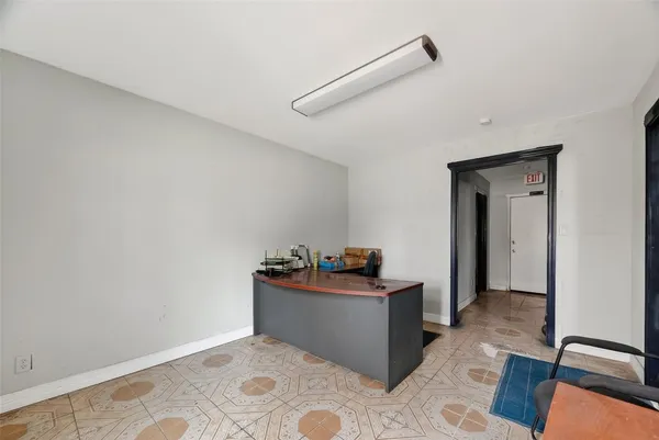 a view of a storage & utility room with a window