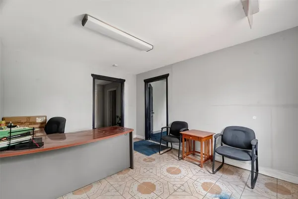 a work room with furniture and a window