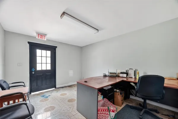 a workspace with furniture and window