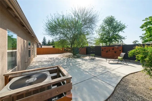 a view of backyard with a patio