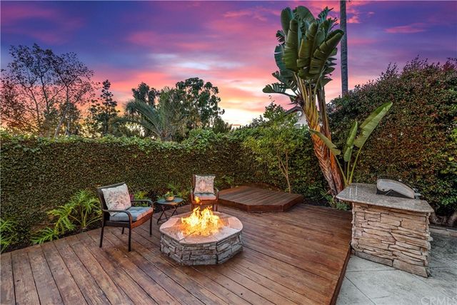 a view of a chairs and table in the patio