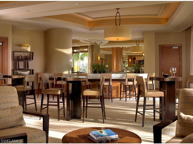 13675 Vanderbilt Drive, Unit 1107 Naples, FL 34110 - Photo 11 of 23 a view of a dining room with furniture