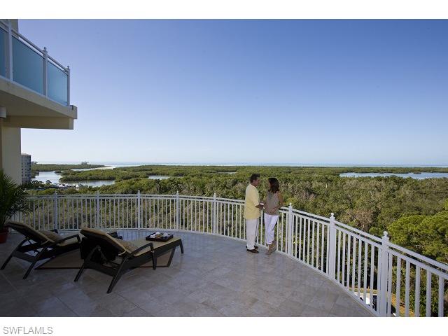 13675 Vanderbilt Drive, Unit 1107 Naples, FL 34110 - Photo 20 of 23 a view of a chair in a balcony