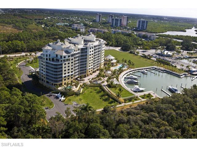 13675 Vanderbilt Drive, Unit 1107 Naples, FL 34110 - Photo 2 of 23 a view of a city with tall buildings
